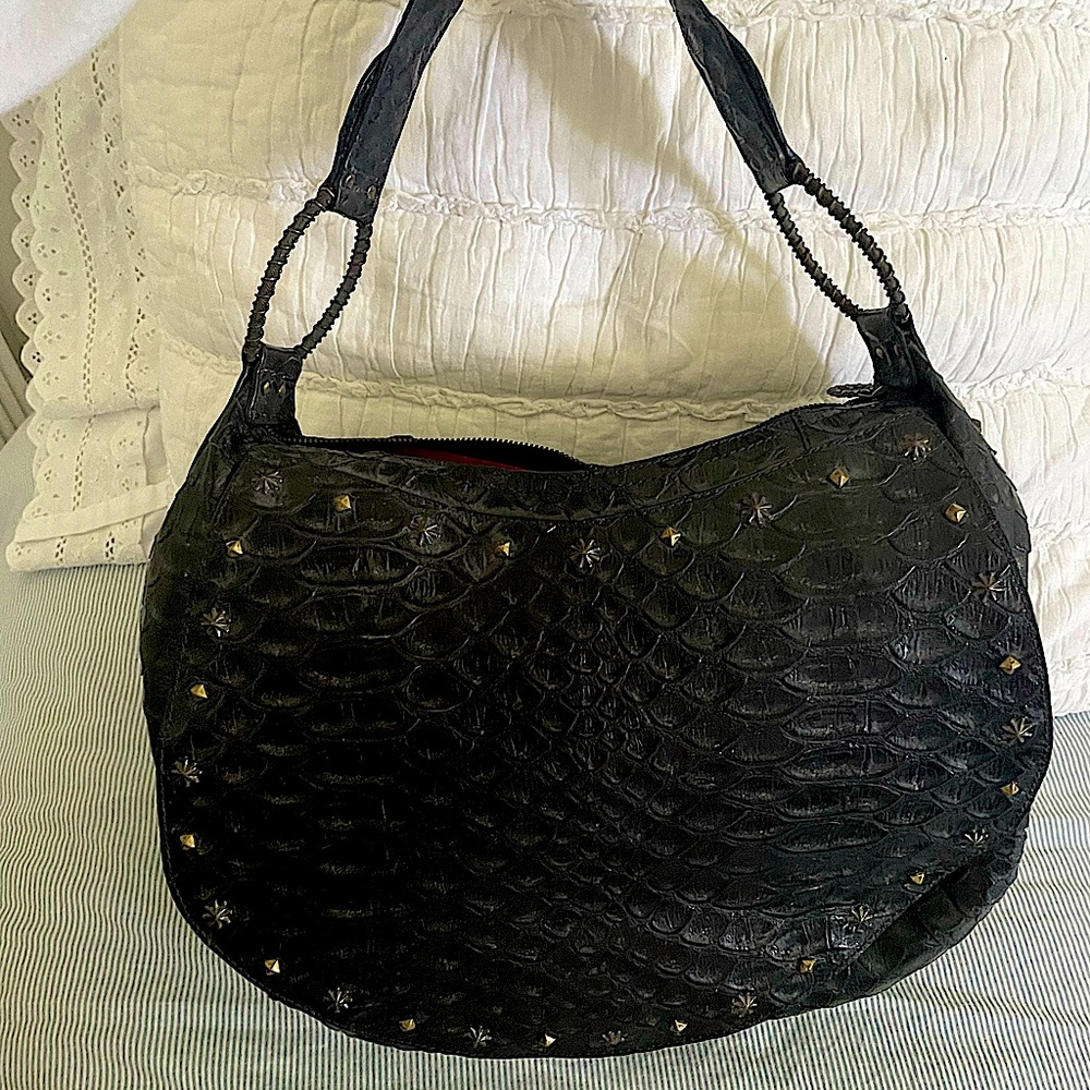 Gorgeous handbag. Black with brass hardware. Worn once & preserved in a dust bag